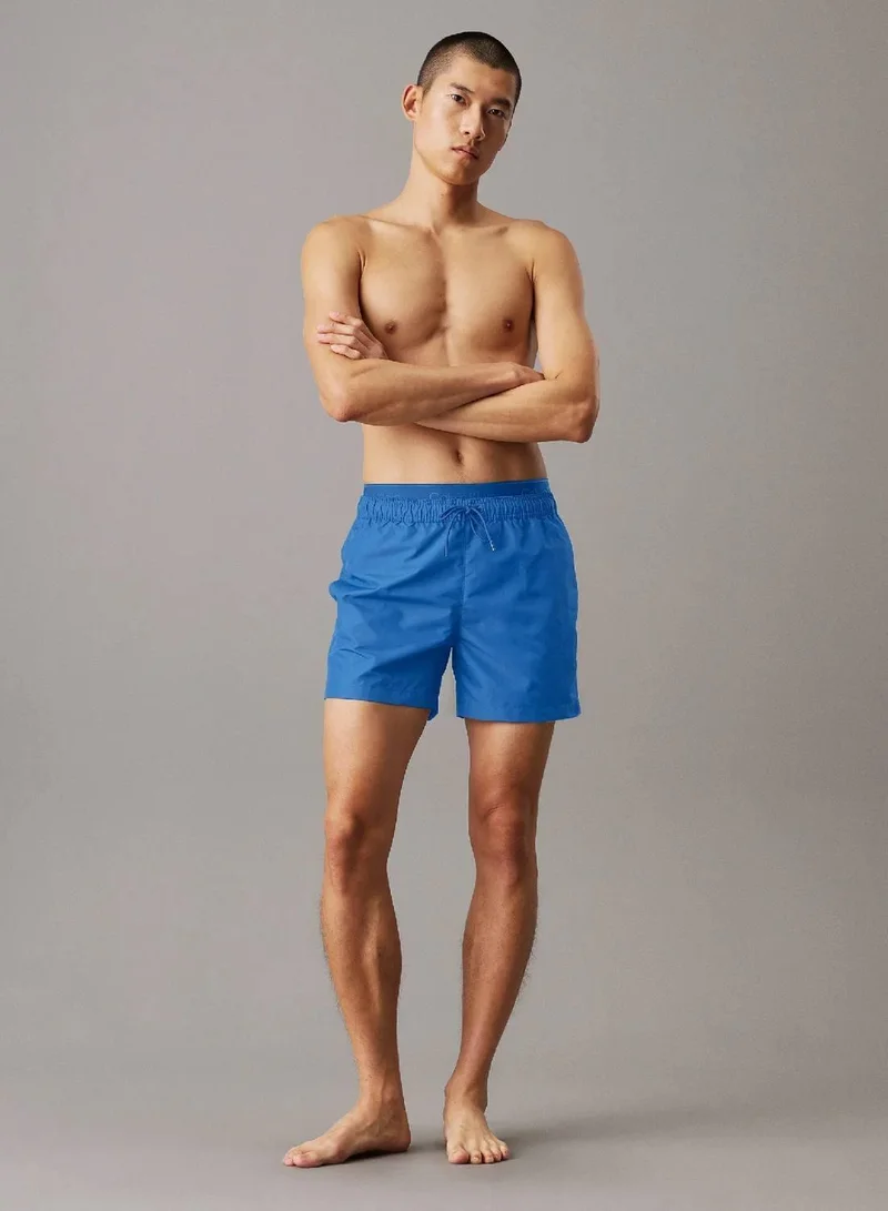 Calvin Klein Patch Of Blue Double Waistband Swim Shorts - CK Meta Legacy for Men | Best Price UAE