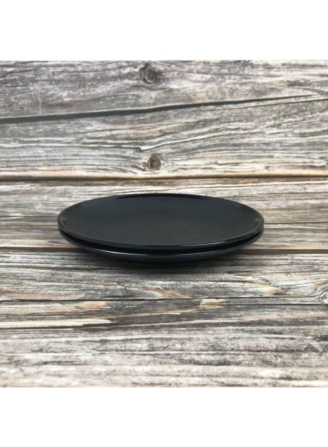 Set of 6 black melamine plates, 18 cm each  Break-resistant  Elegant and distinctive serving plates for main dishes  Made of melamine, these plates are lightweight yet durable.  Their 18 cm size makes them suitable for serving a variety of dishes. - Image 1