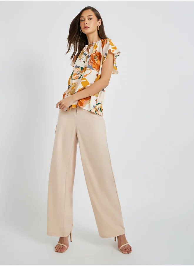 تايك تو Floral Print Batwing Sleeve Tie-Up Neck Blouse