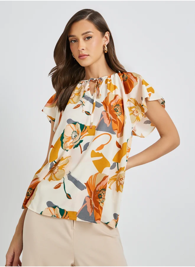 تايك تو Floral Print Batwing Sleeve Tie-Up Neck Blouse
