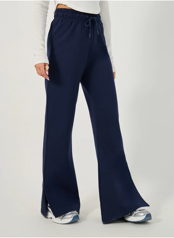 Styli Solid Drawstring Waist Flared Joggers with Side Slit
