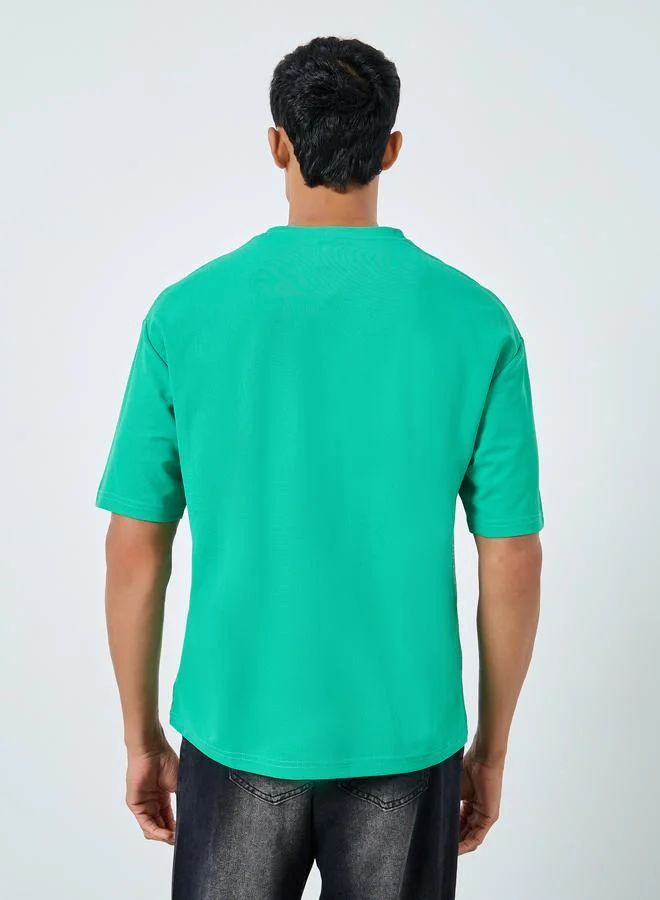 Styli Oversized Cut and Sew Detailing Graphic Printed T-Shirt