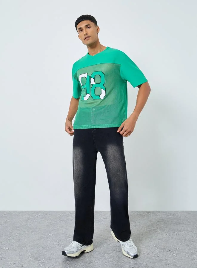 Styli Oversized Cut and Sew Detailing Graphic Printed T-Shirt