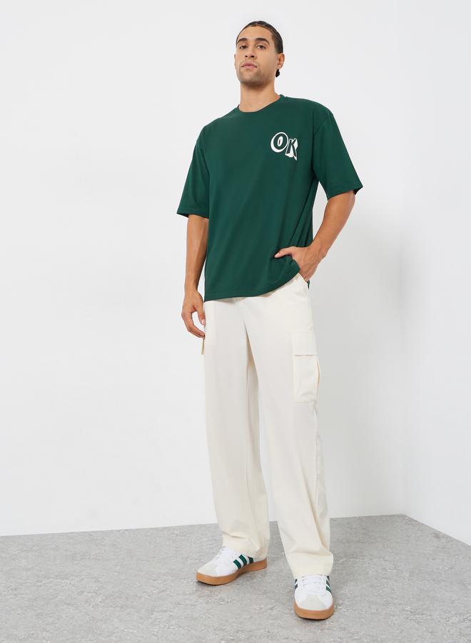 Styli Men Green Oversized Graphic Print T-Shirt - Image 2