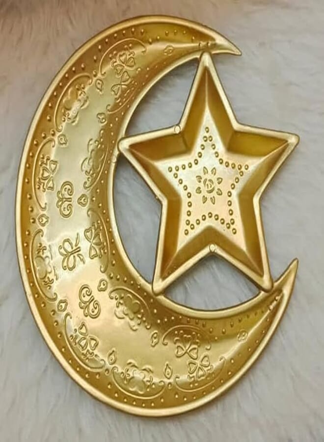 "Enjoy the uniqueness of Ramadan with a golden plate decorated with a star and a crescent, and the aesthetics of sweets and nuts from Pegui Belle store."