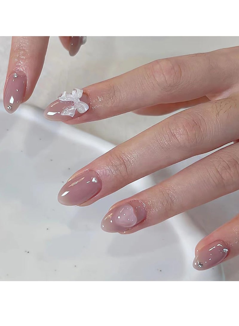 جوسكوين أظافر صناعية فرنسية، أظافر بلون وردي نيود موحد قابلة للارتداء مع فيونكة وقلب أبيض، 24 قطعة، أظافر أكريليك وهمية مع مجموعة أدوات الغراء. - Image 1