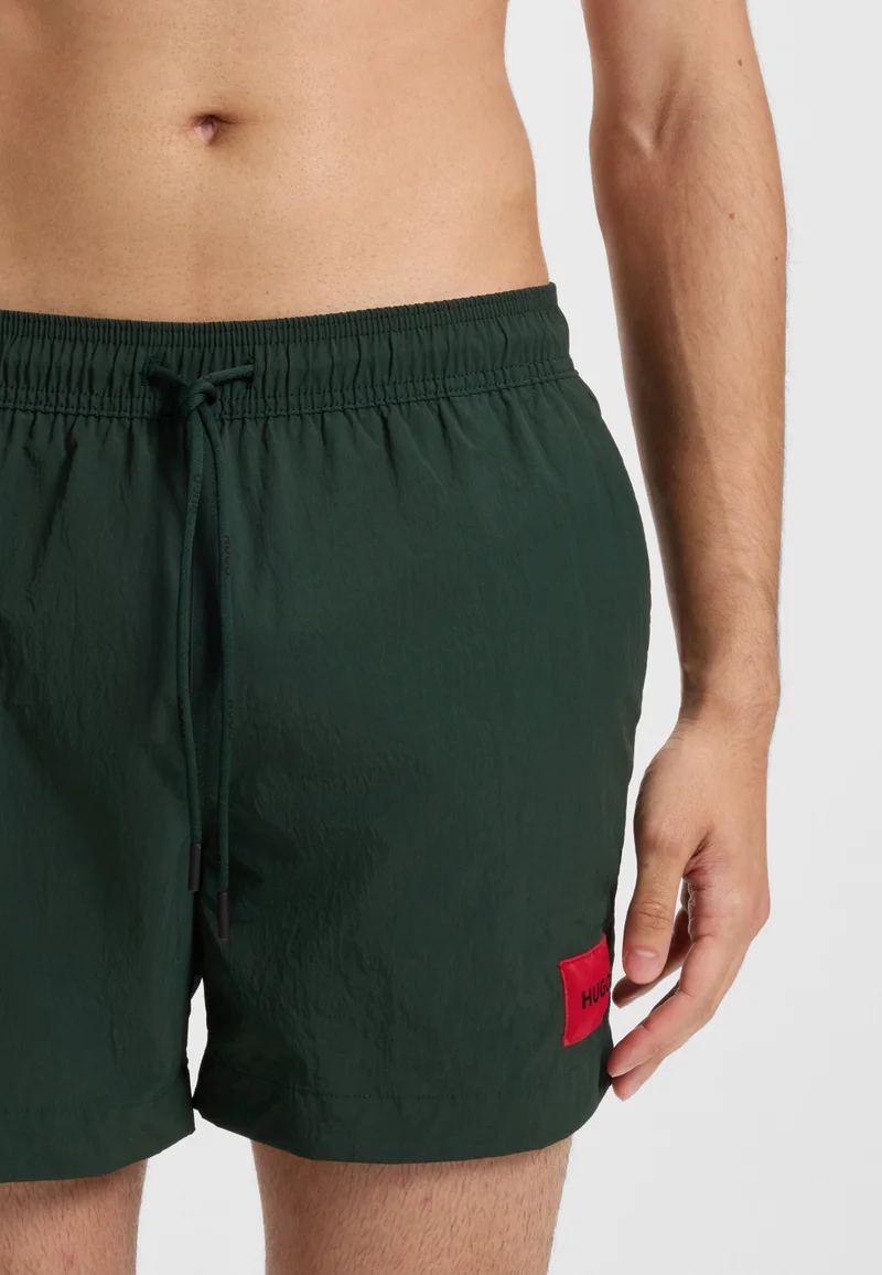 HUGO  Swim shorts with logo label for Men | Best Price UAE