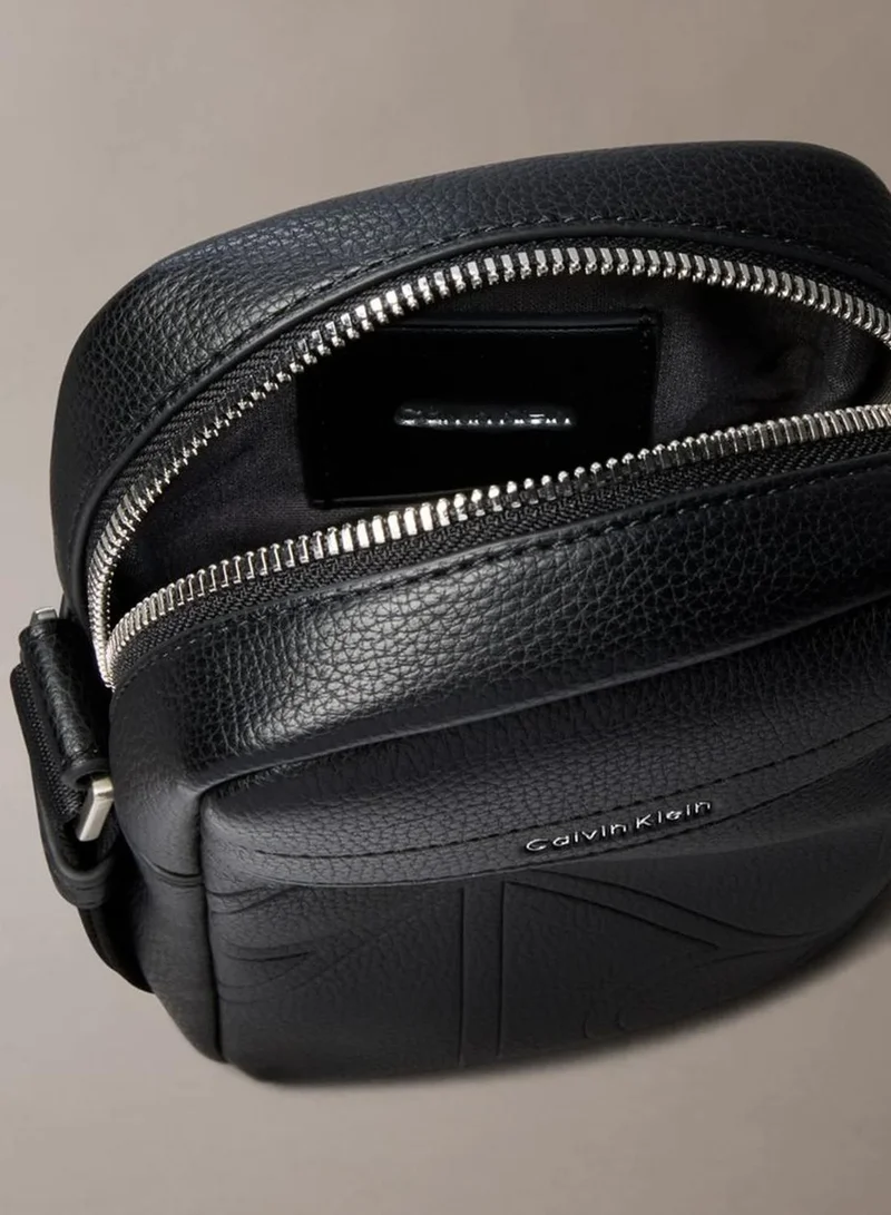 Calvin Klein Black Allover Embossed Emblem Logo Slim Reporter Bag for Men | Best Price UAE