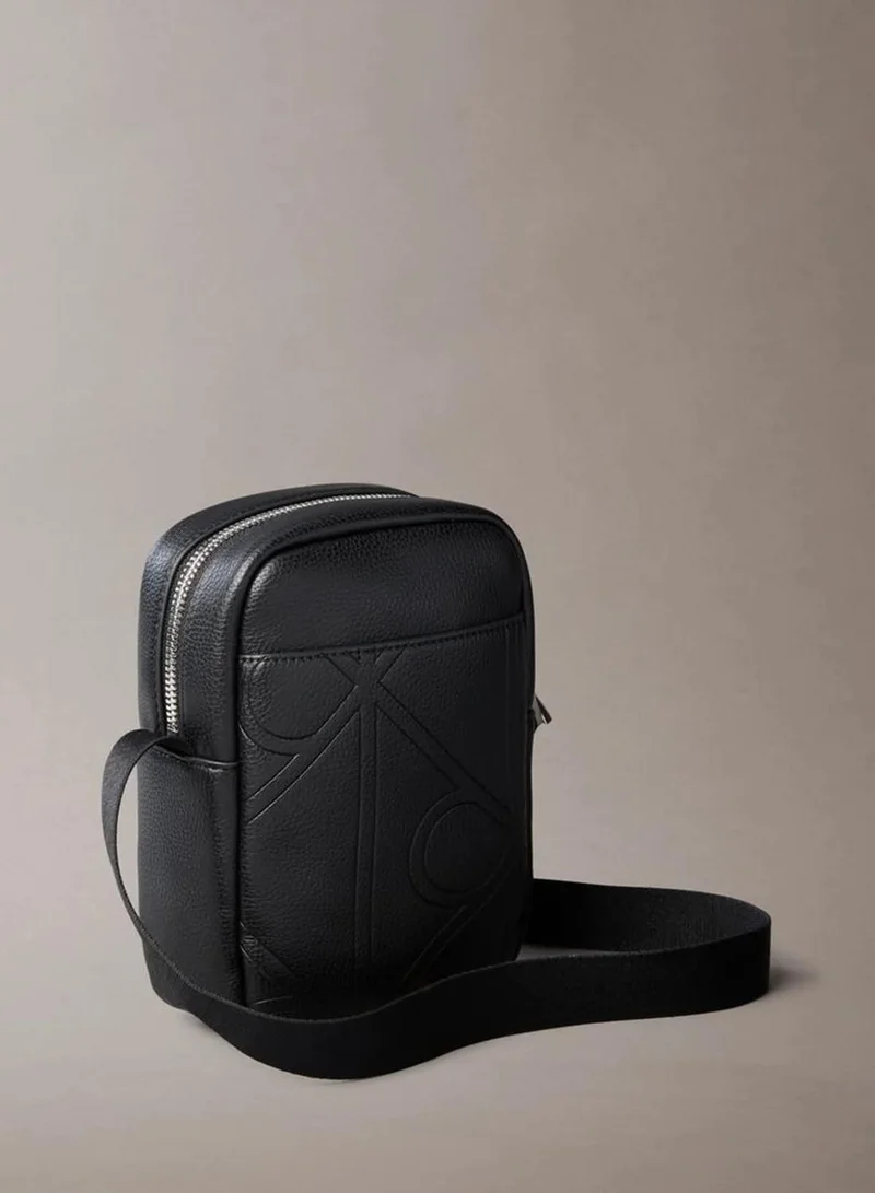Calvin Klein Black Allover Embossed Emblem Logo Slim Reporter Bag for Men | Best Price UAE