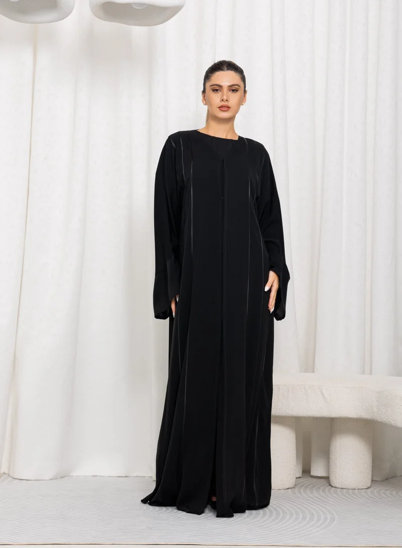 نيكياس عباية سوداء من نيدا بيبينج