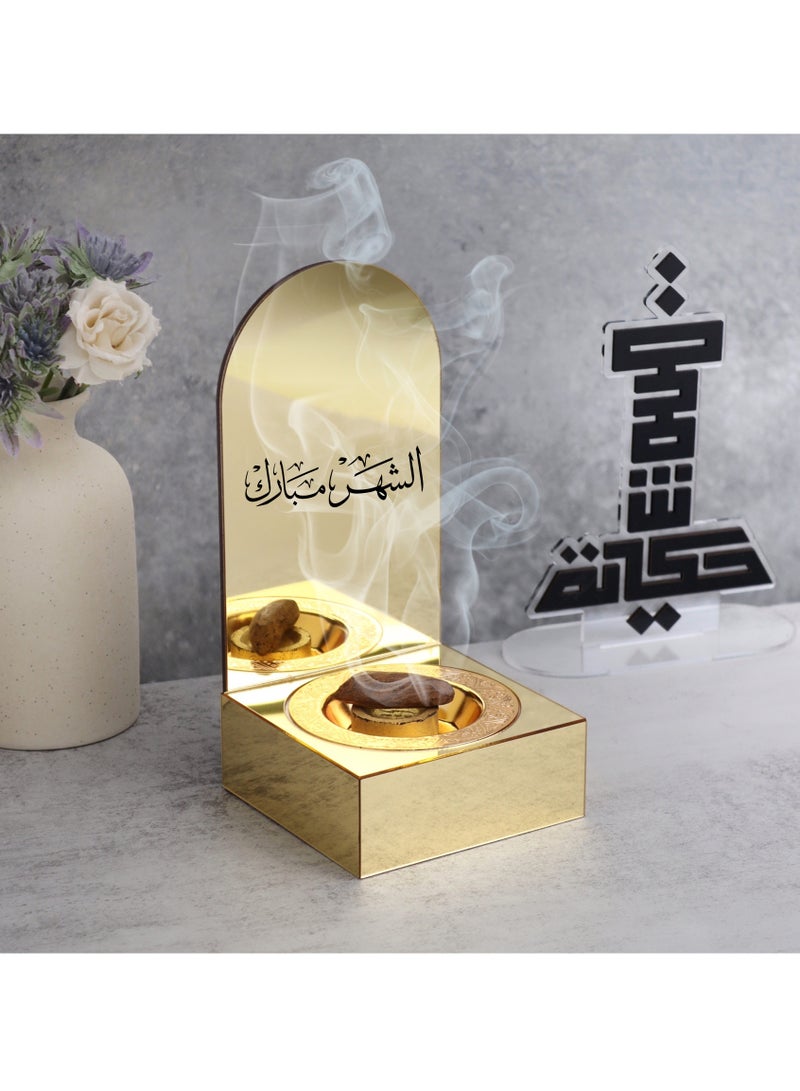حكاية شمعة مبخره بخور مصنوعه من الاكريليك اللامع ، تحمل عبارة "الشهر مبارك" بتصميم مميز وبلون ذهبي - Image 1