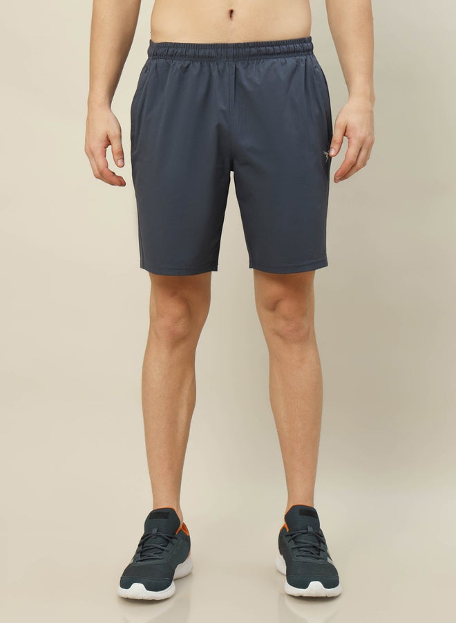 تكنوسبورت شورت مطاطي ثنائي الاتجاه بلون سادة - Image 1