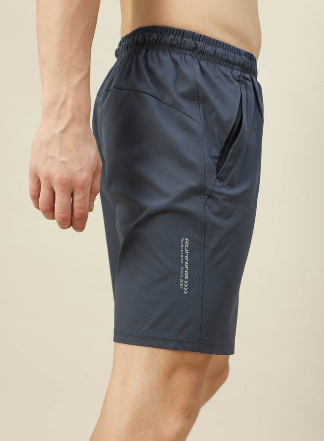 تكنوسبورت شورت مطاطي ثنائي الاتجاه بلون سادة - Image 2