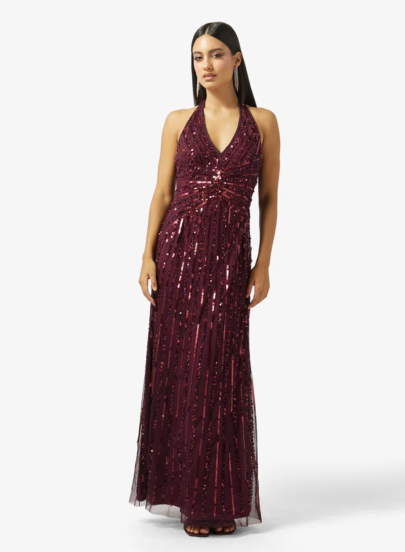 نمشي x فستان بياقة هالتر مزين