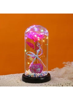 Surprise your loved ones with this Beauty and the Beast Enchanted Rose, a stunning red silk rose encased in a glass dome with LED lights and a pinewood base. A timeless symbol of love, perfect for Birthday Gifts for Women, Mum, Grandma, Sister, or Nan. Ideal for Anniversary, Valentine's Day, Mother's Day, and Christmas. Create a magical ambiance with this elegant and heartfelt keepsake.