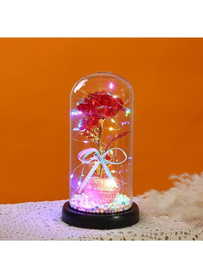 Generic - Surprise your loved ones with this Beauty and the Beast Enchanted Rose, a stunning red silk rose encased in a glass dome with LED lights and a pinewood base. A timeless symbol of love, perfect for Birthday Gifts for Women, Mum, Grandma, Sister, or Nan. Ideal for Anniversary, Valentine's Day, Mother's Day, and Christmas. Create a magical ambiance with this elegant and heartfelt keepsake. - Image 1