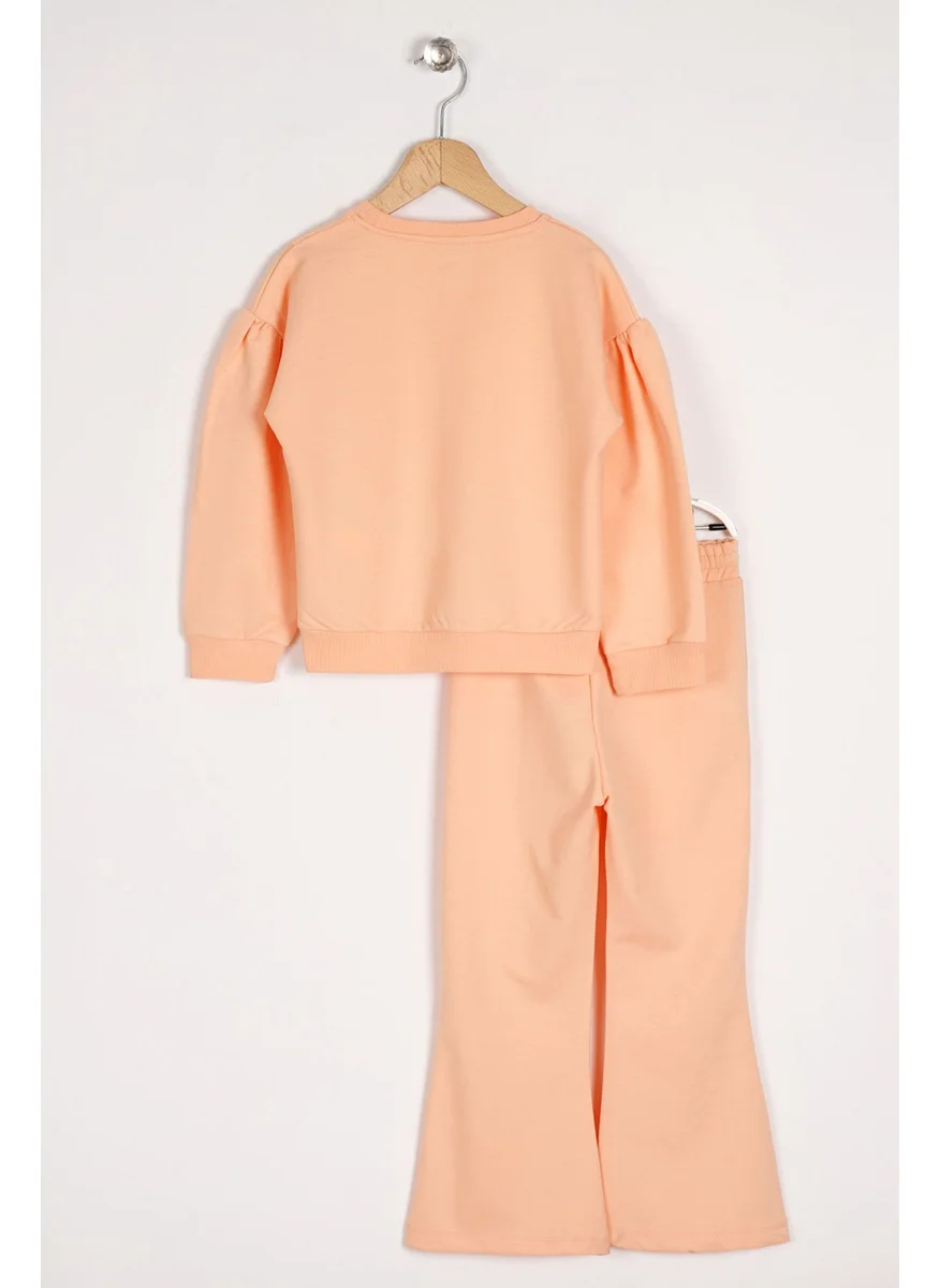 Zepkids Girls Salmon Colored Long Sleeve Tracksuit with Daisy Detail on the Slit
