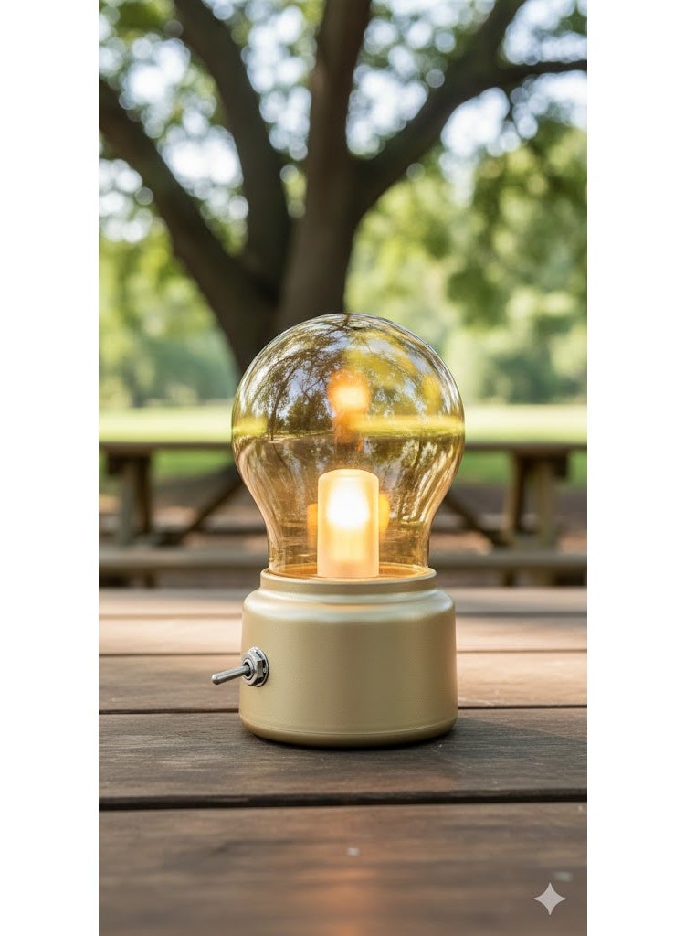 Portable rechargeable LED table lamp in the shape of a classic bulb, retro gold design, for indoor and outdoor use. - Image 1