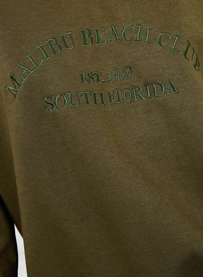 ستايلي Oversized Embroidered Slogan Cotton Sweatshirt