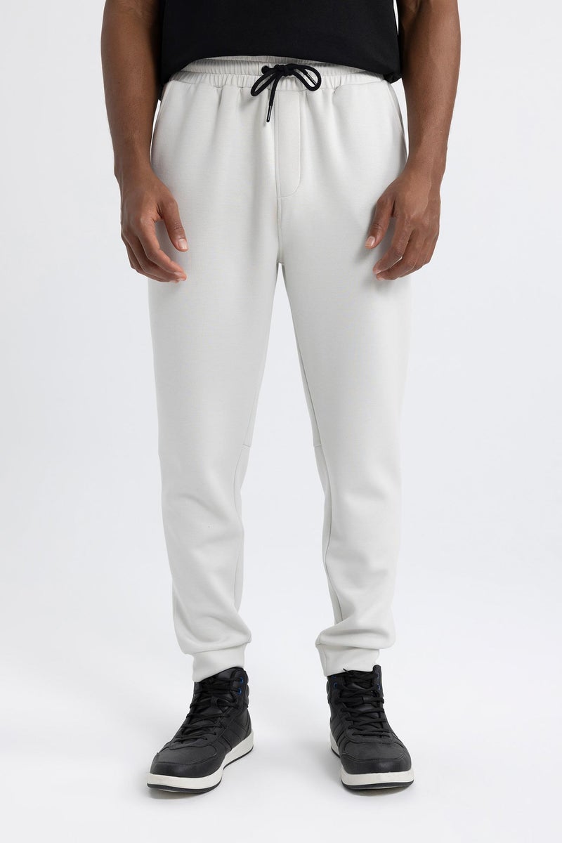 ديفاكتو بنطال رياضي رجالي DeFactoFit بقصة Slim Fit وساق قياسية للغوص والغطس مصنوع من القماش  - Image 1