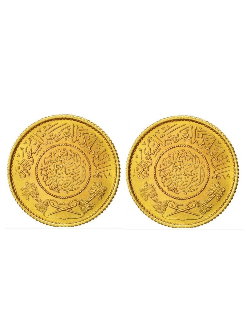 Two Saudi gold coins, 24-karat, weighing 1 gram each.