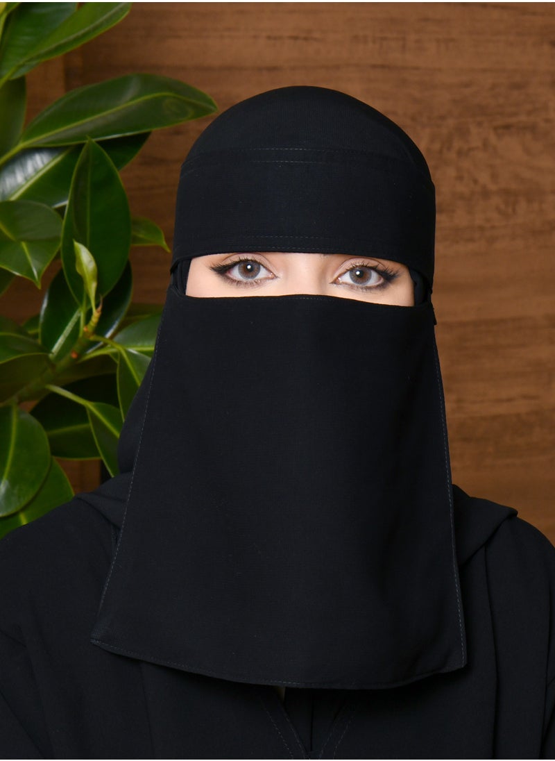 A short niqab with a silk lining with one elastic and a tie closure