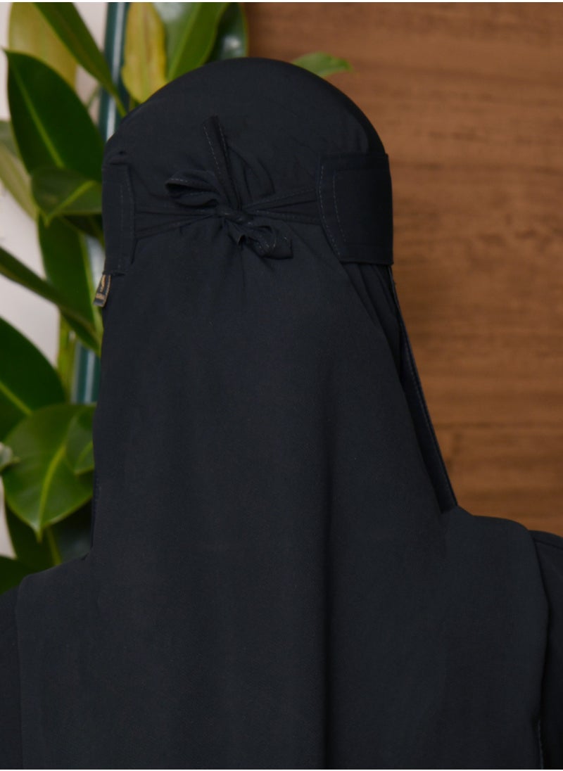 A short niqab with a silk lining with one elastic and a tie closure