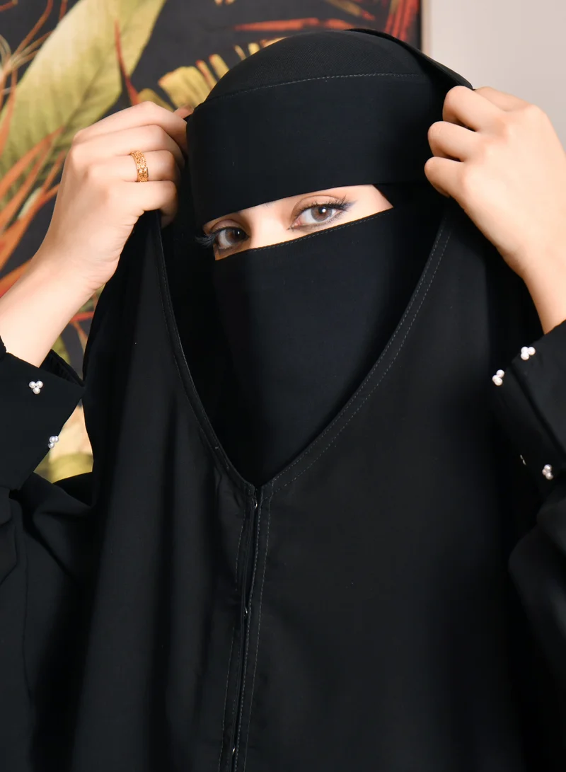 HAWRAA ABAYA Closed cape abaya with narrow sleeves decorated with small white pearls
