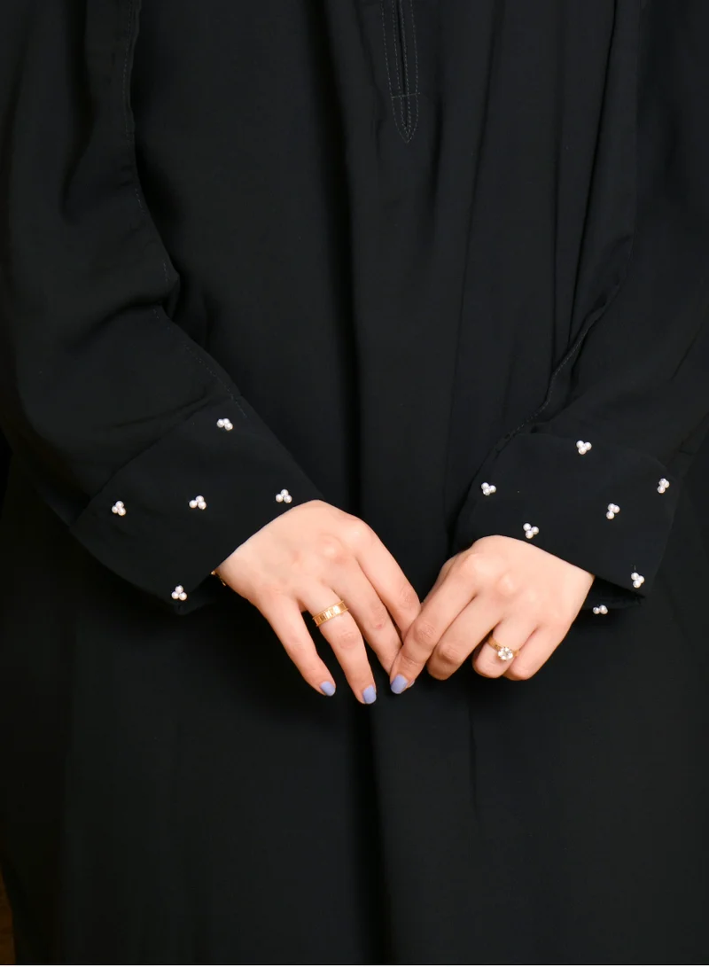 HAWRAA ABAYA Closed cape abaya with narrow sleeves decorated with small white pearls