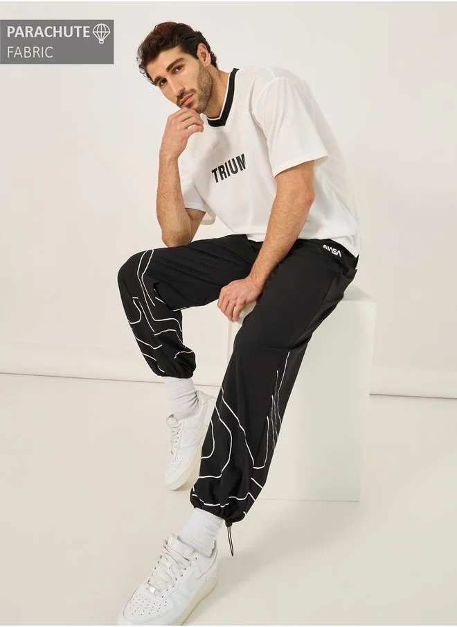 ستايلي NASA Print Parachute Track Pants with Toggle Cuffed