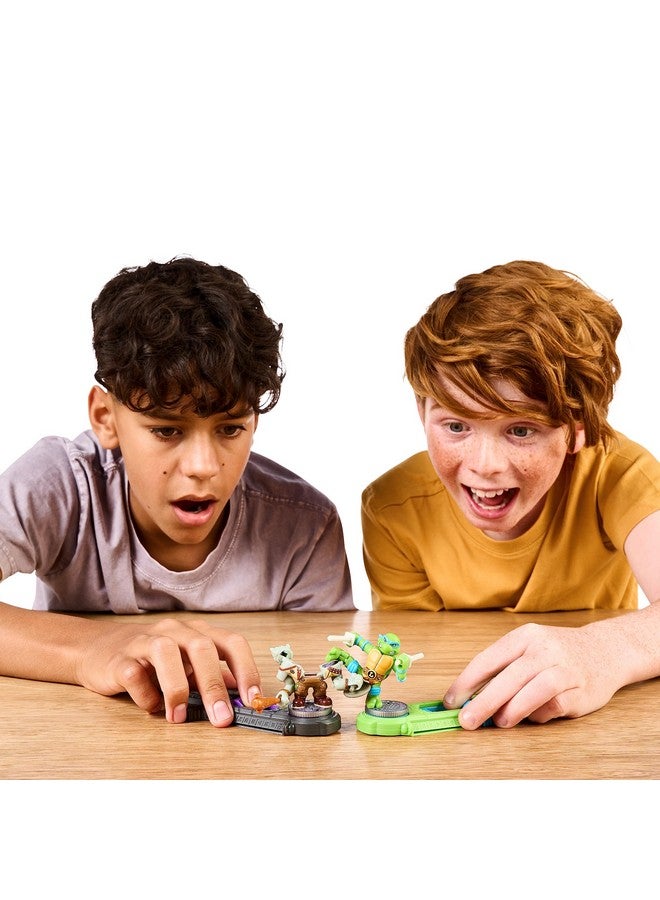 AKEDO Legends of Akedo Teenage Mutant Ninja Turtles. Mini Battling Warriors Versus Pack Michelangelo Vs Bebop With 2 Figures, 1 Instruction Manual, 2 Trigger Controllers - Image 2