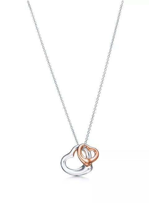 Elsa Peretti® Open Heart pendant in sterling silver and 18k rose gold.