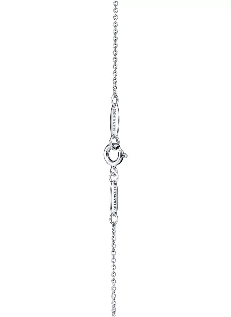 Elsa Peretti® Open Heart pendant in sterling silver and 18k rose gold.