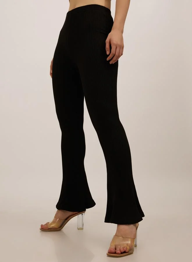 Outzidr  Black Ribbed Basic Flared Leggings for Women | Best Price UAE