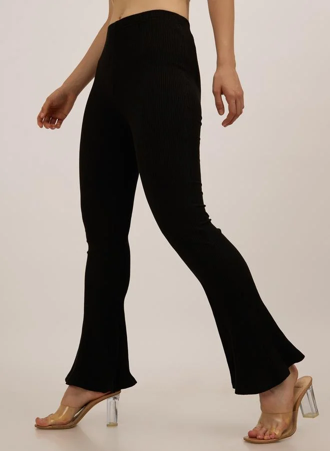 Outzidr  Black Ribbed Basic Flared Leggings for Women | Best Price UAE