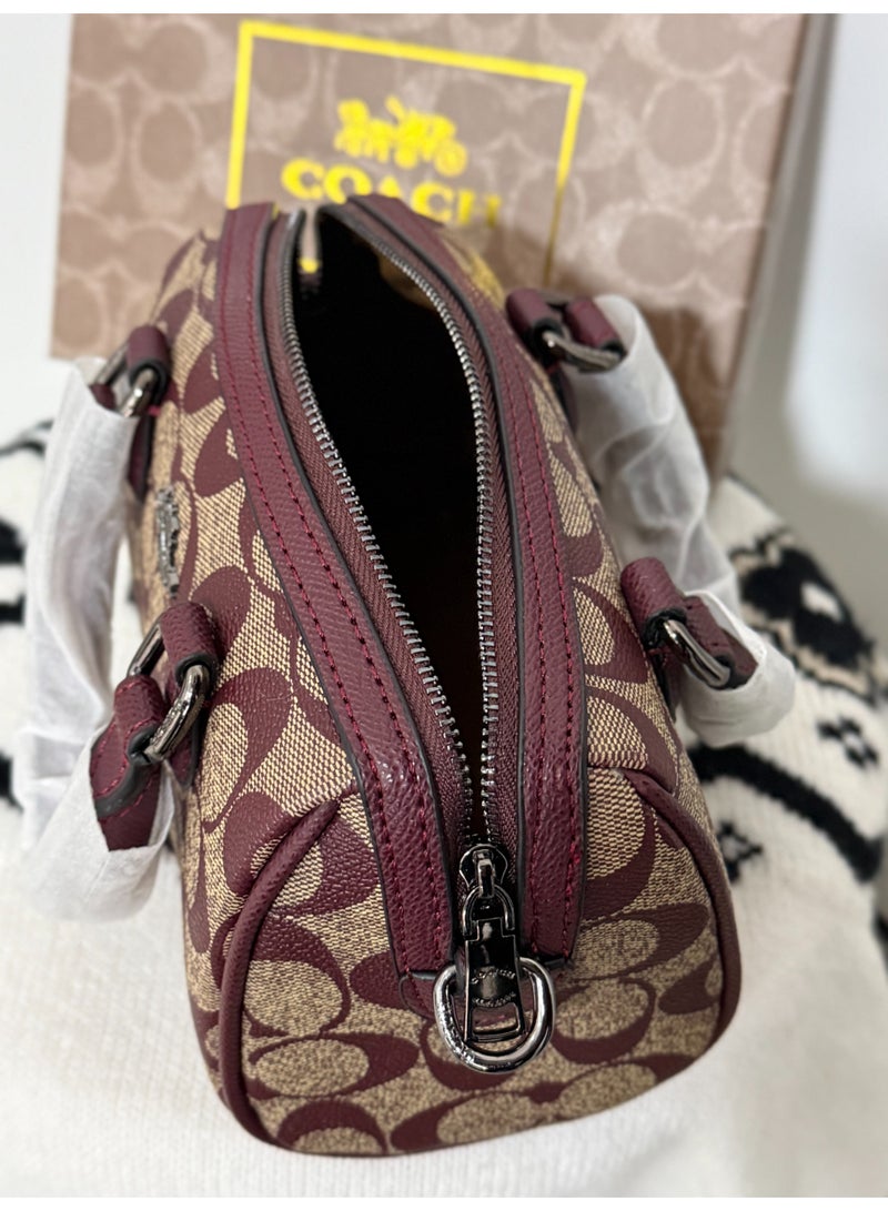 coachoutlet Coach Mini Rowan Mini Boston Bag is a handbag, women's shoulder bag, crossbody bag, briefcase, clutch, and evening bag, as well as a shopping tote bag. For all occasions including work, travel, parties, and gift-giving. - Image 4