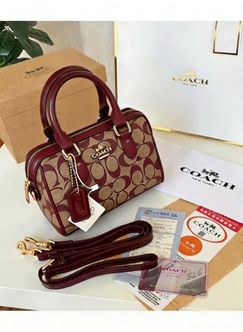 coachoutlet Coach Mini Rowan Mini Boston Bag is a handbag, women's shoulder bag, crossbody bag, briefcase, clutch, and evening bag, as well as a shopping tote bag. For all occasions including work, travel, parties, and gift-giving. - Image 1