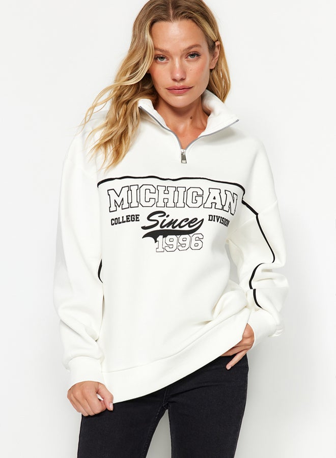 trendyol Ecru Zippered Printed Oversize/Wide Fit Thick Fleece Inside Knitted Sweatshirt - Image 1