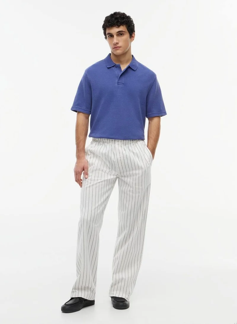 Tommy Jeans Blue Storm Regular Fit Washed Waffle Knit Polo Shirt for Men | Best Price UAE