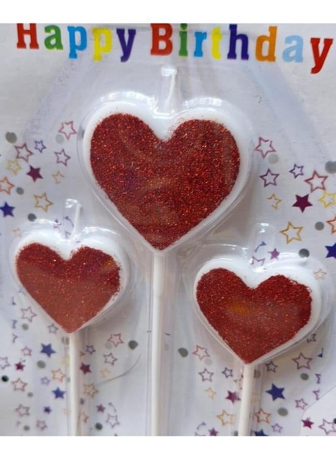 شمعة عيد ميلاد على شكل قلب باللونين الأحمر والأبيض