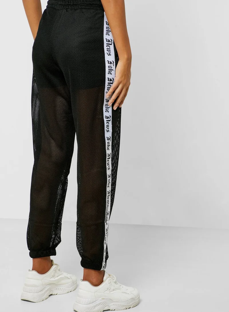 FOREVER 21 Side Slogan Fish Net Jogger Pants