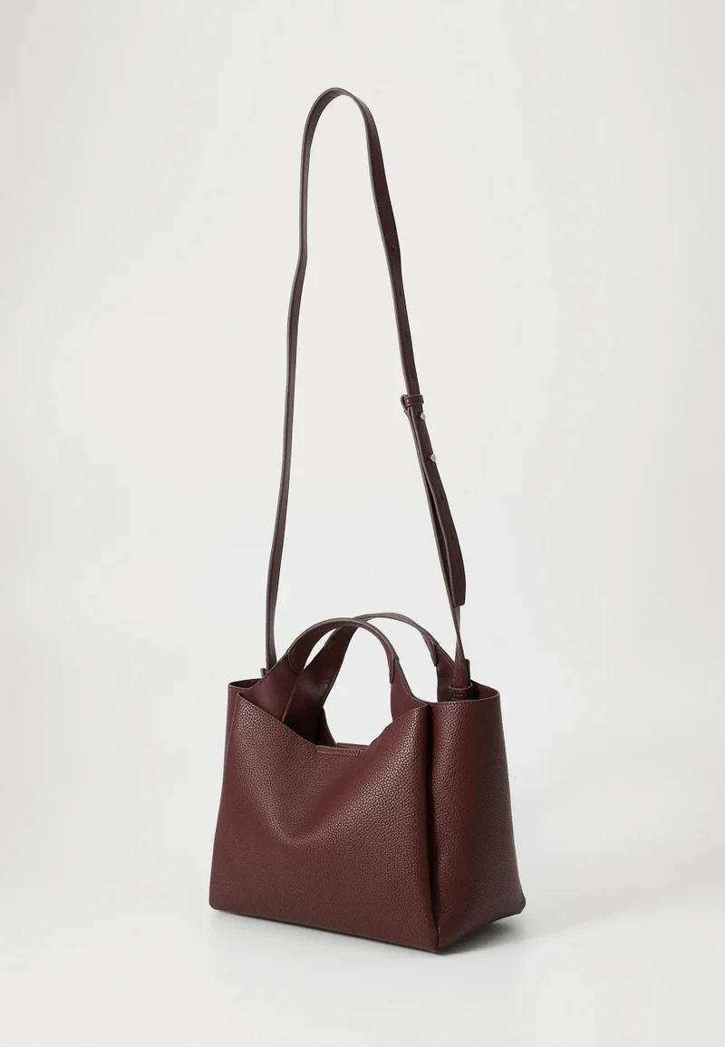 د ك ن ي حقيبة يد علوية بشعار ويلا