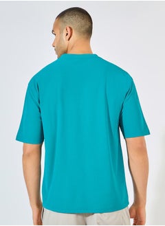 Styli Micro Pique Knit Oversized T-Shirt with Reflective Logo  - Image 4