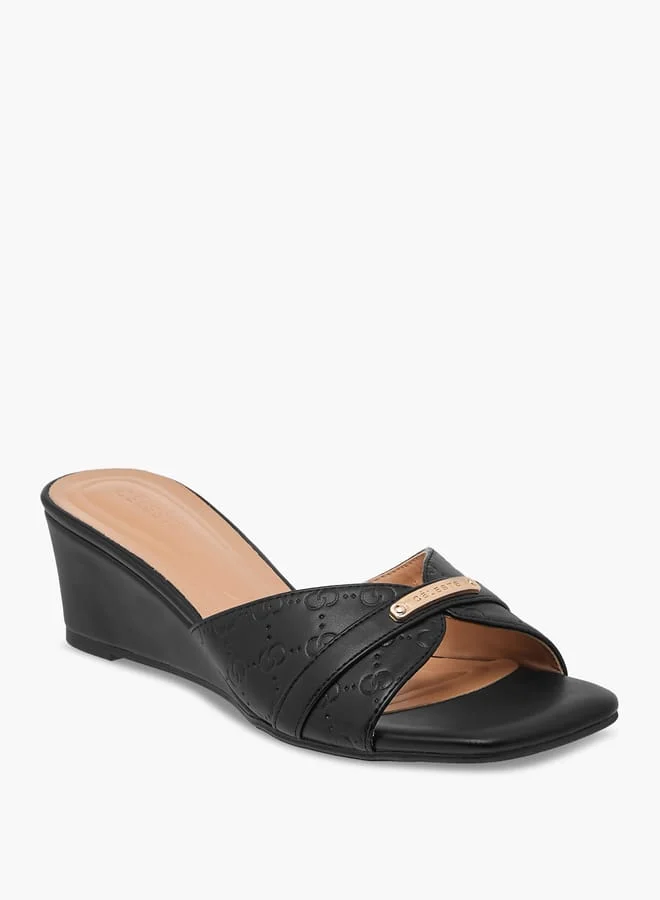 سيليست صنادل نسائية سهلة الارتداء بنقش المونوغرام وكعب ويدج