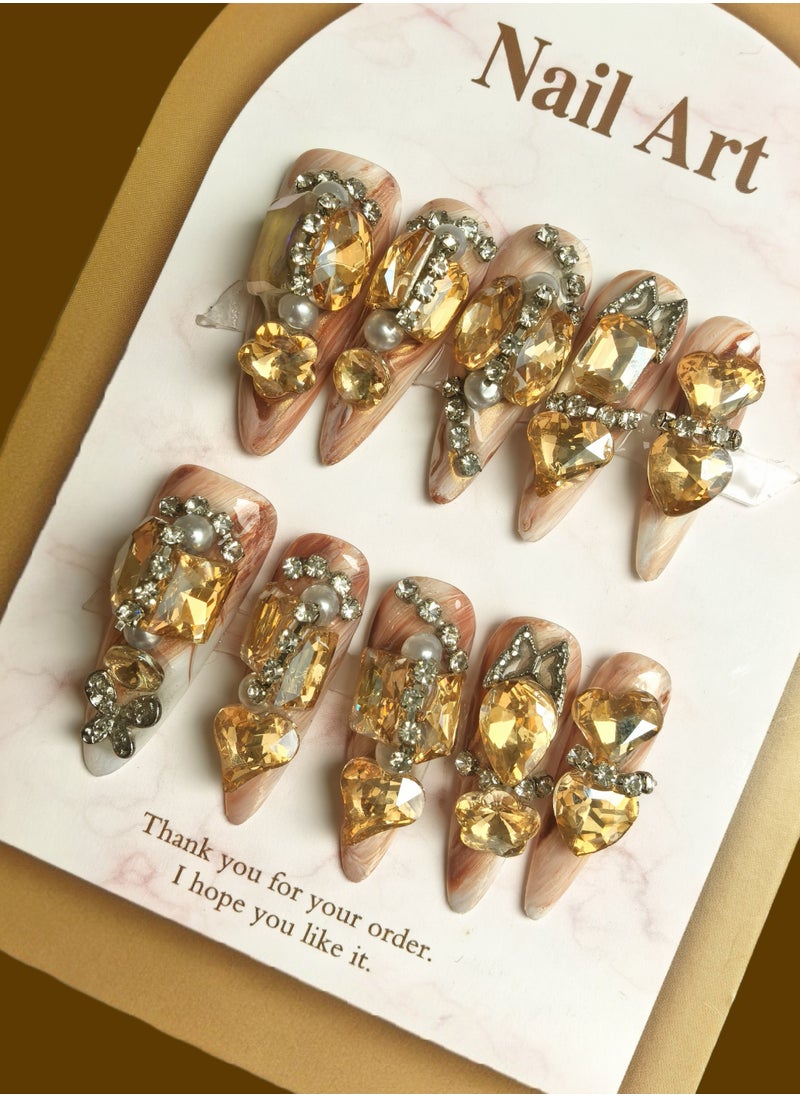 Generic Glamorous Stiletto Nail Art Set: Chic Stiletto-Shaped Nails with a Subtle Nude Base, Adorned with Luxurious Golden Crystals and Pearls - Elevate Your Manicure Game  - Image 1