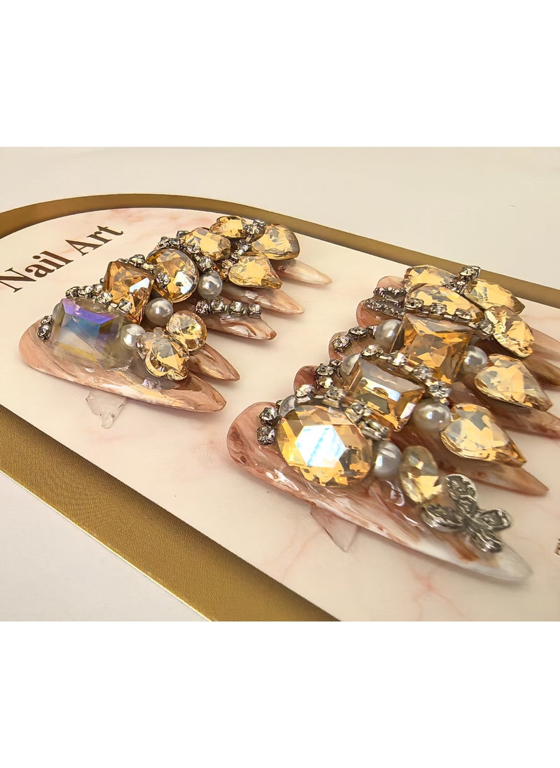 Generic Glamorous Stiletto Nail Art Set: Chic Stiletto-Shaped Nails with a Subtle Nude Base, Adorned with Luxurious Golden Crystals and Pearls - Elevate Your Manicure Game  - Image 2
