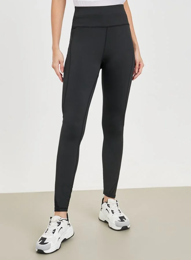 ستايلي Cut Out Back Mesh Detail Top and Stitch Detail Active Legging Set