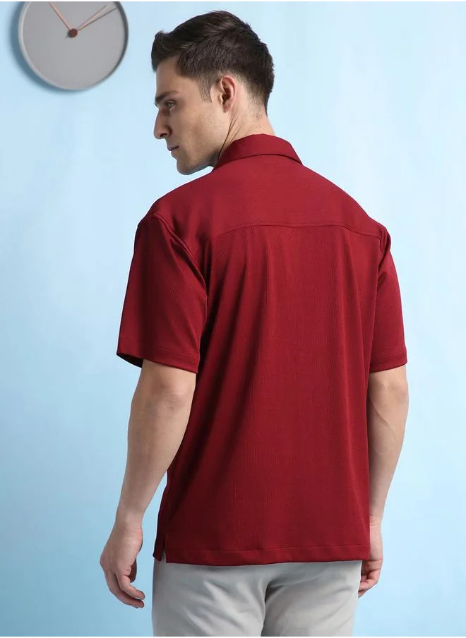 دينيس لينغو Maroon Relaxed Fit Cuban Collar Half Sleeve Shirt for Men, designed with a textured 100% poly fabric for a sleek and stylish appeal – the perfect pick for any trendsetter.