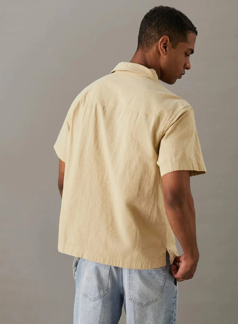 كالفن كلاين جينز قميص مريح بأكمام قصيرة