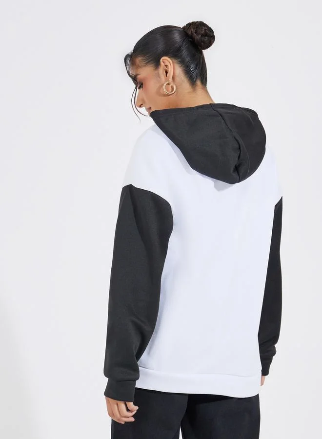 Styli Oversized Longline Color Block Slogan Hoodie